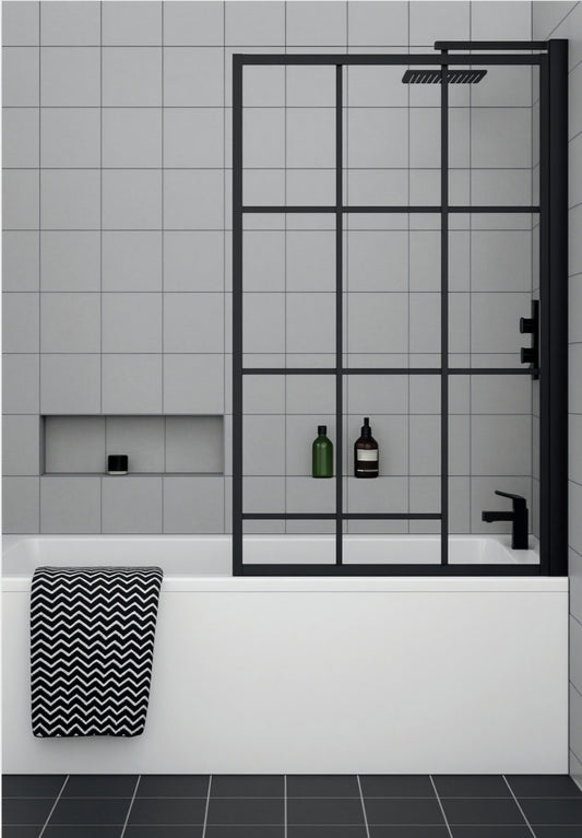 Bathroom with a black framed grid bath screen, white bathtub, and gray tiled walls.